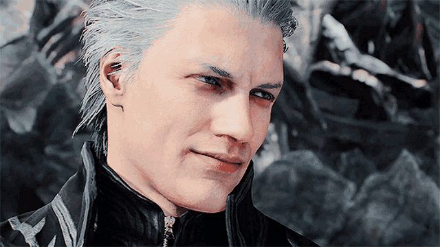 a close up of a man 's face with blue eyes