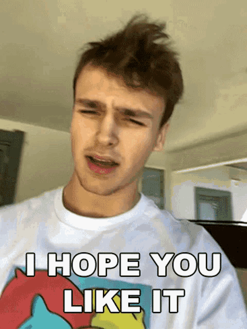 a young man wearing a t-shirt that says " i hope you like it "