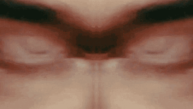 a close up of a person 's face with their eyes open