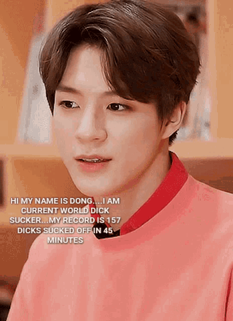 a young man is wearing a pink shirt and a red collar