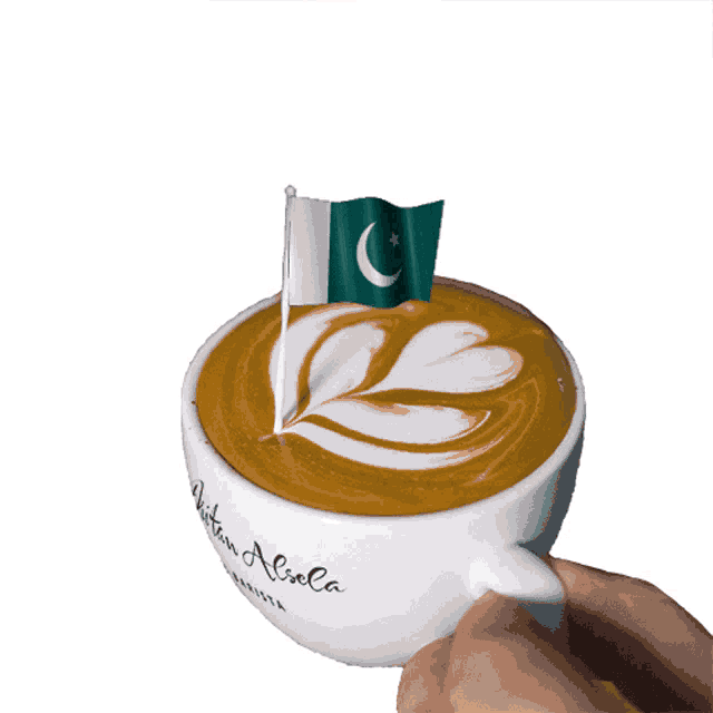 a cup of cappuccino with a flag on top