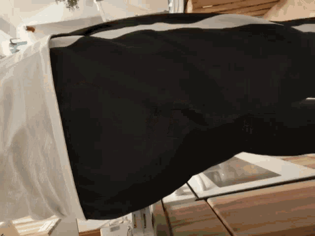 a person wearing a white shirt and black pants