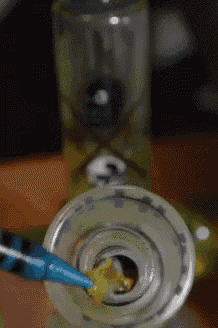 a close up of a glass pipe with a blue tip