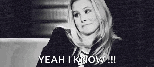 a black and white photo of a woman sitting on a couch with the words `` yeah i know '' written below her .