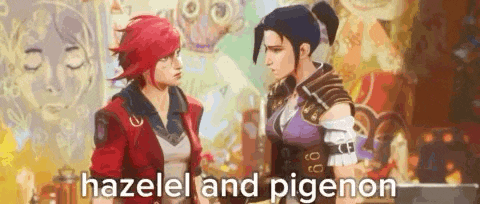 two women are standing next to each other in front of a wall and talking to each other .