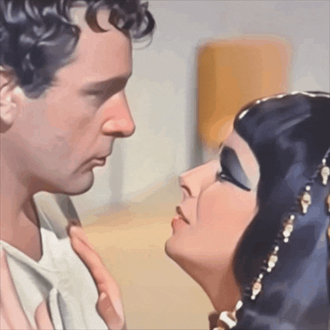 a painting of a man and woman kissing with the woman wearing a head scarf