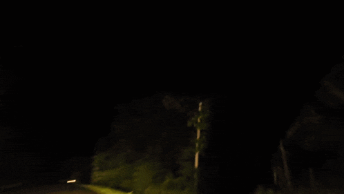 a blurred image of a road at night