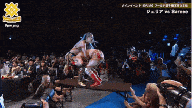 a wrestling match between julia vs sareee is being shown