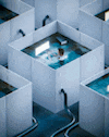 a person is swimming in a pool of water in a maze of squares .