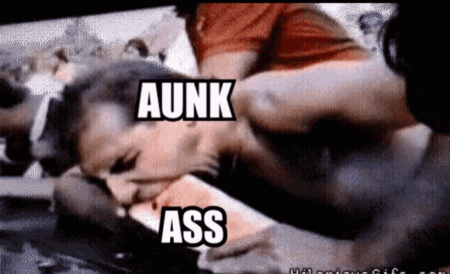 a man is laying on a woman 's face with the words aunk and ass written above him