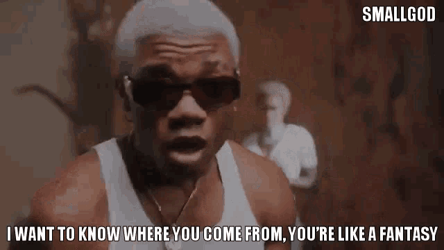 a man in a white tank top is saying i want to know where you come from . you 're like a fantasy .