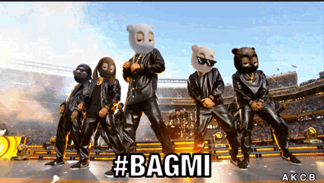 a group of people wearing masks are dancing on a stage with the hashtag #bagmi