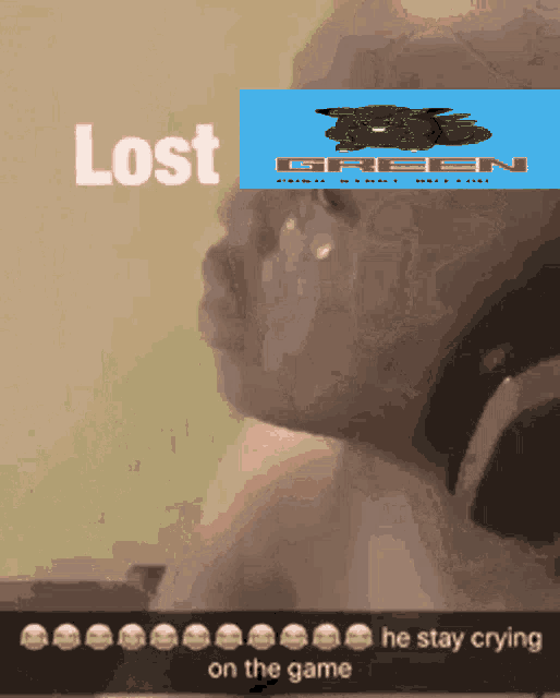 a baby is crying in front of a picture of a green frog