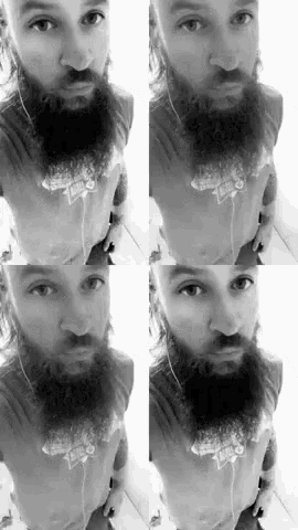 a black and white photo of a man with a beard wearing a taco bell t-shirt