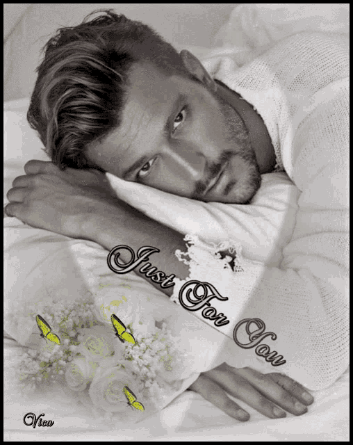 a picture of a man laying on a bed with the words just for you on the bottom