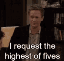 a man in a suit is talking to another man and says i request the highest of fives .