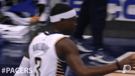 a basketball player wearing a headband with the number 7 on it