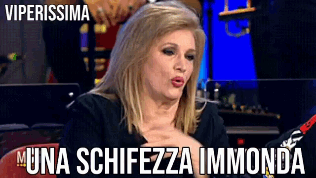 a picture of a woman with the caption viperissima muna schiezza immonda