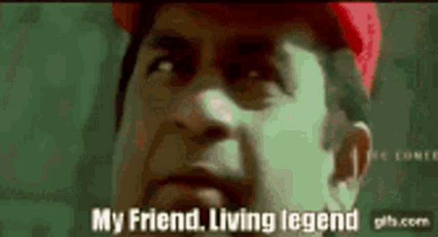 a man in a red hat is talking about his friend living legend .