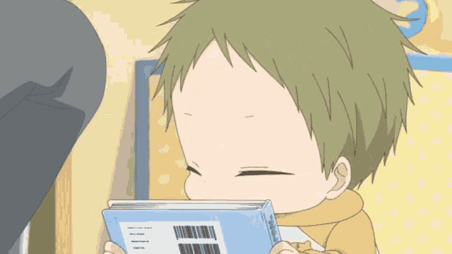 a baby is reading a book with a barcode on it