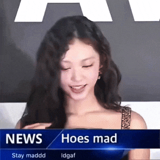 a woman is sitting in front of a news screen that says news hoes mad