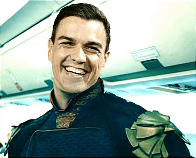 a man in a superhero costume is smiling in front of a sign that says " emergency exit "