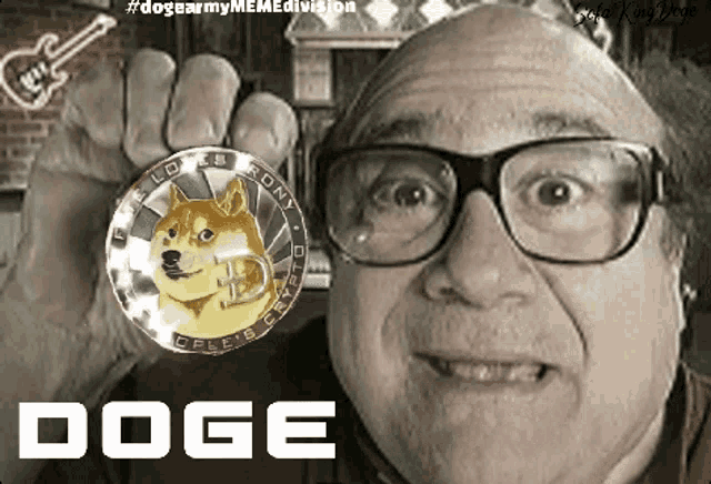 a man with glasses holds a doge coin in his hand