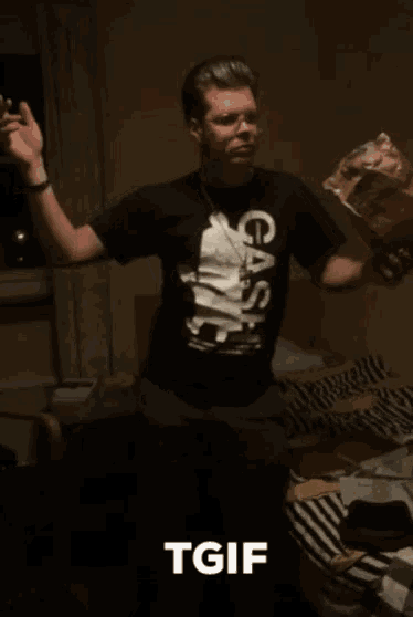 a man in a black case shirt is holding a bag