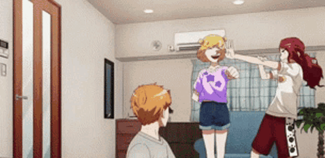 a man and two women are dancing in a living room