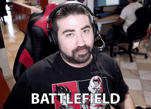 a man wearing headphones and a battlefield t-shirt
