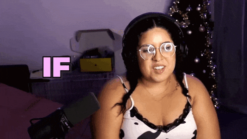 a woman wearing headphones and glasses says " if "