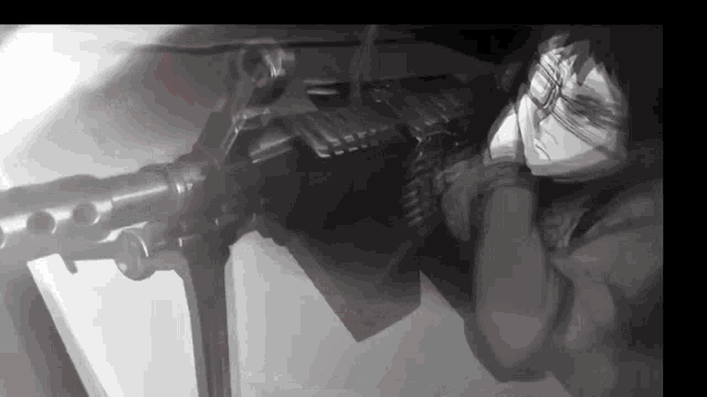 a black and white photo of a person holding a gun