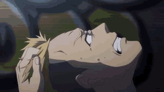 a close up of a person laying on their back with their head down and their eyes closed .