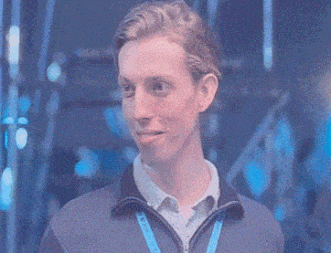a man with a lanyard around his neck that says ' samsung ' on it