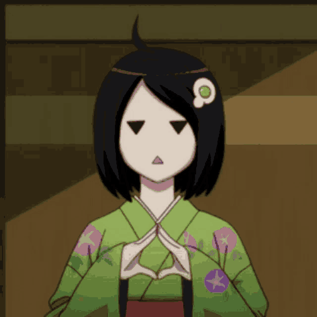 a girl in a green kimono with a flower on her head