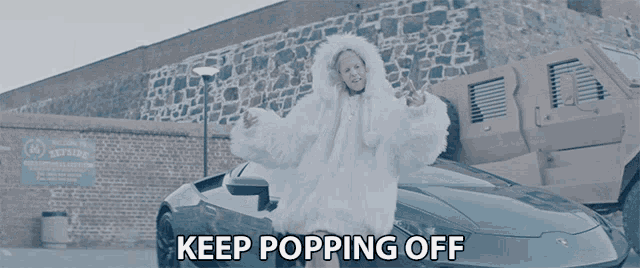a woman in a white fur coat is standing next to a car and the words keep popping off are above her