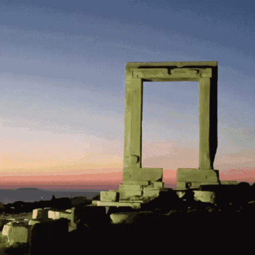 a stone archway with a purple sky in the background