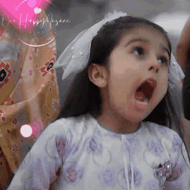 a little girl with her mouth open and the words one happy insaan written on the bottom