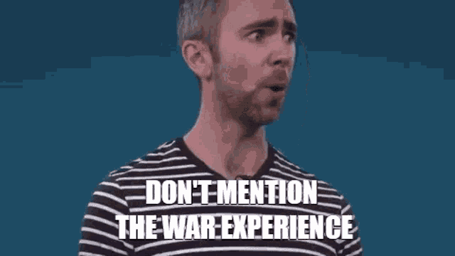 a man in a striped shirt is making a funny face and says `` don 't mention the war experience '' .