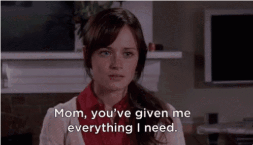 a woman says " mom you 've given me everything i need " in front of a fireplace