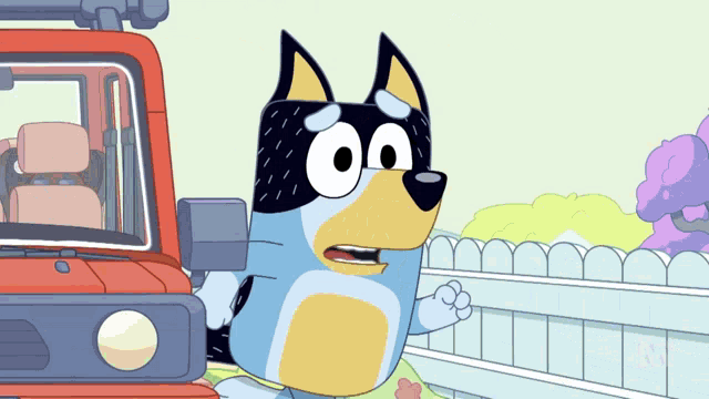a cartoon dog standing in front of a red truck