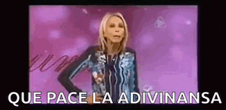 a woman is standing in front of a pink background with the words `` que pace la adivinansa '' written on it .