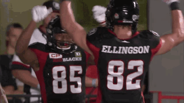 two football players one of whom is wearing number 82
