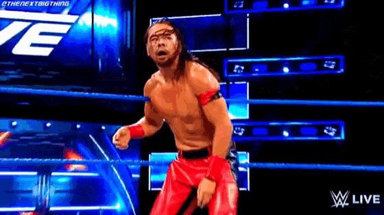 a pixelated image of a wrestler in a wrestling ring with the words wwe live on the bottom