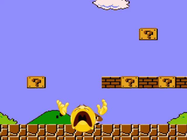 a video game scene with a yellow smiley face and a brick with a question mark on it