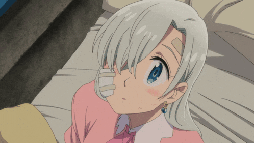 a girl with white hair is laying on a bed with a bandage on her face