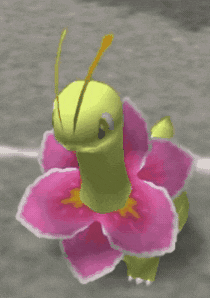 a yellow dinosaur with pink flowers on its neck