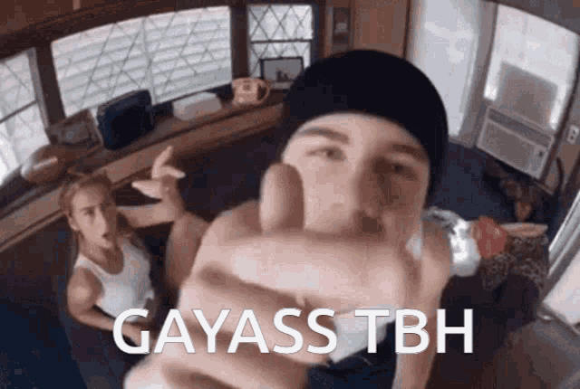 a man giving a thumbs up with the words gayass tbh on the bottom right