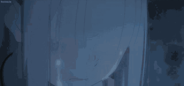 a full moon is visible through a window with a blue sky behind it