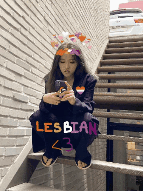 a girl is sitting on a set of stairs looking at her phone with the word lesbian written on the bottom